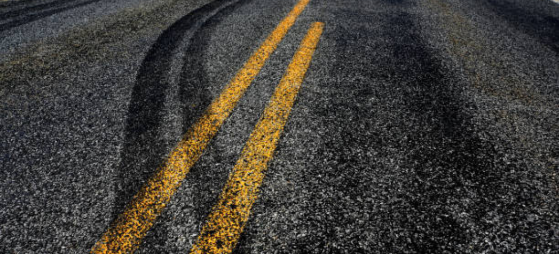What is the average safe life period of a road and how does road patching increase it?